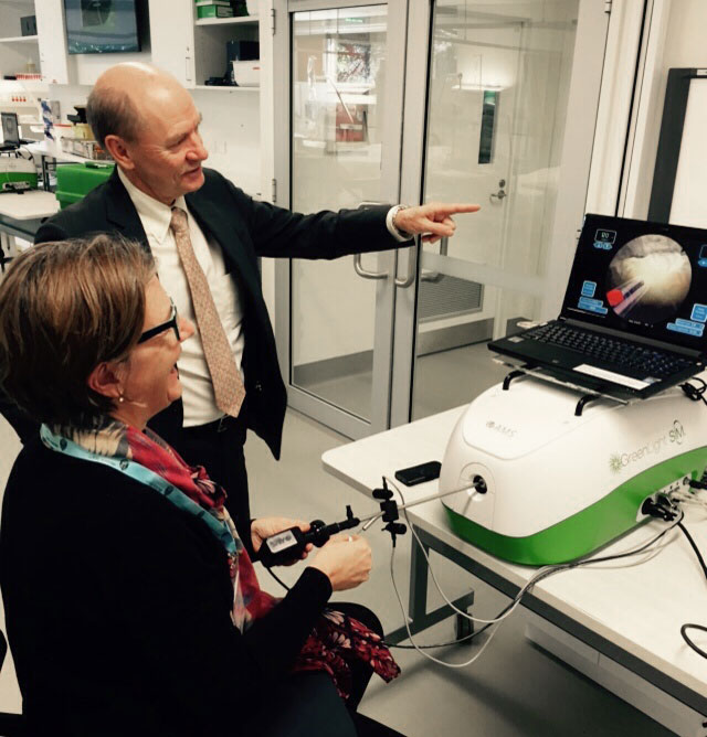 Dr Thomas Dean with a delegate on the green light simulator